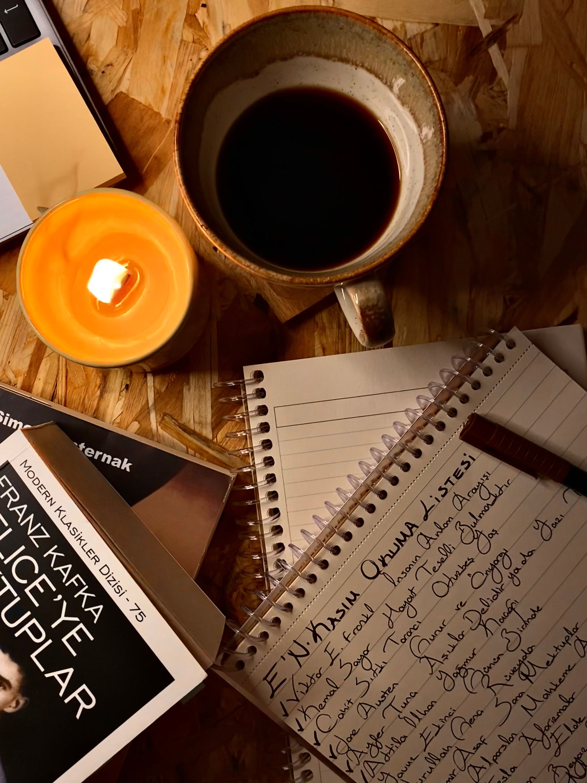 Journal and coffee on a wooden table