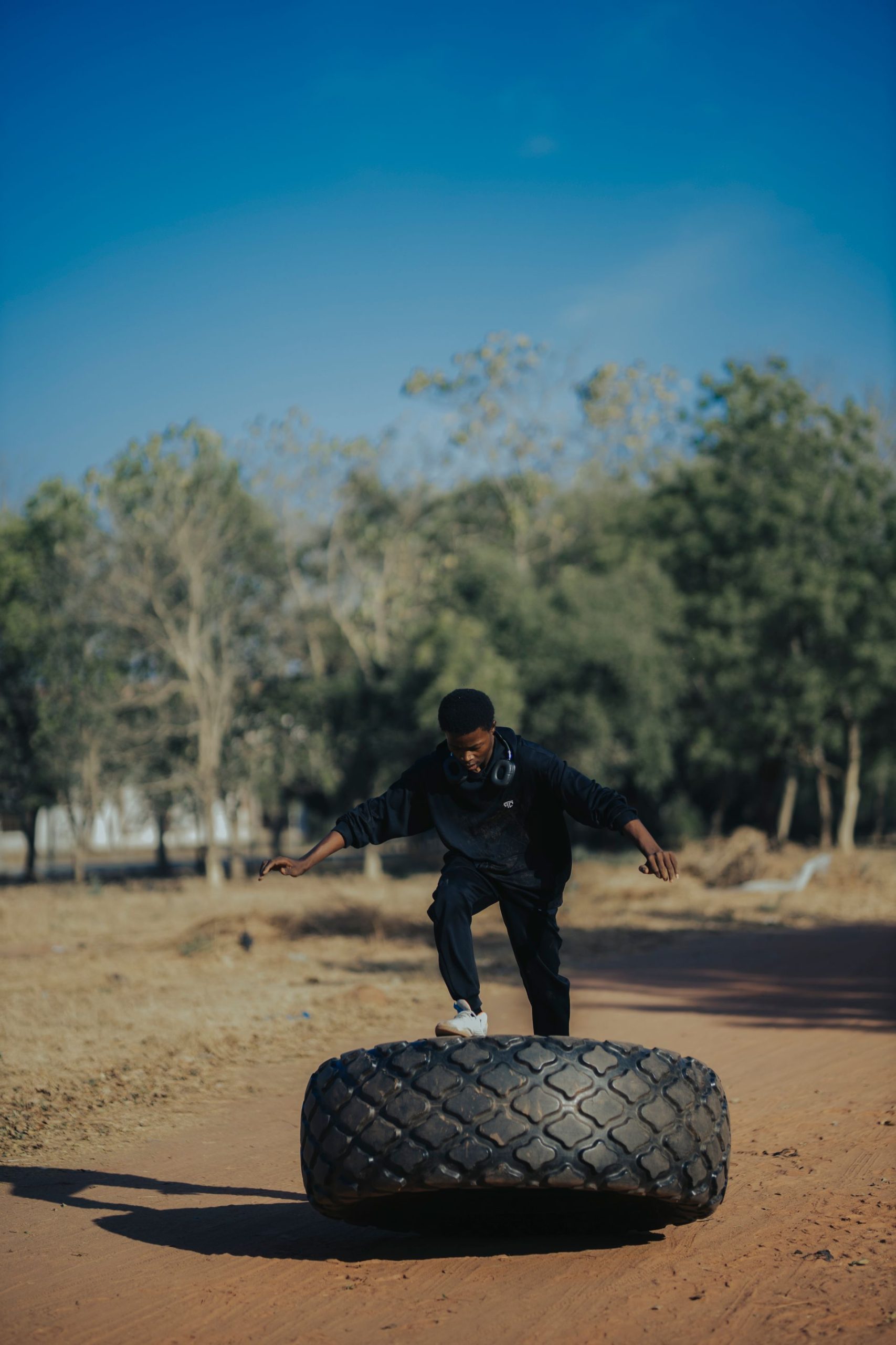 Backyard tire flip session at dusk
