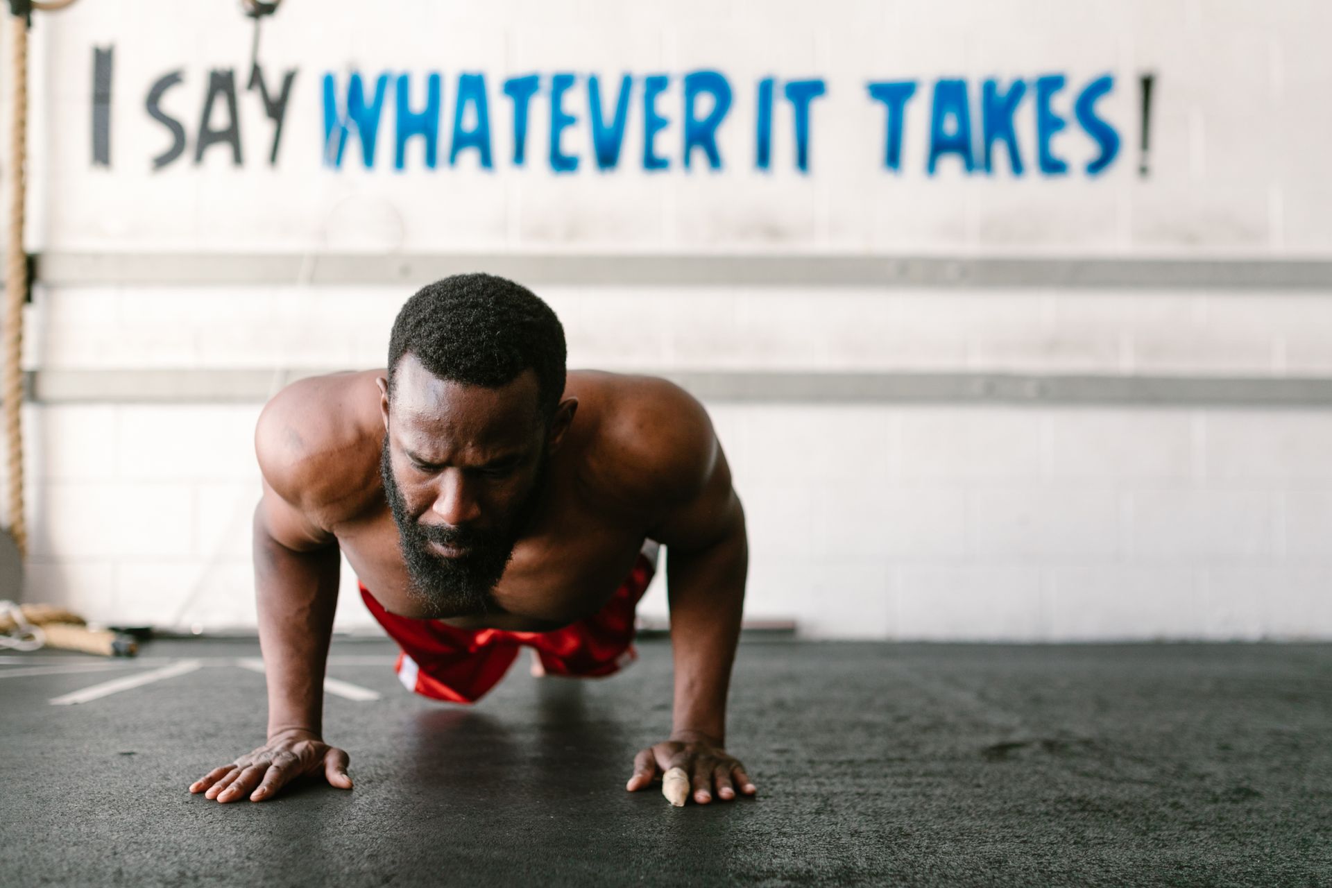 Bodyweight push-up training in a garage